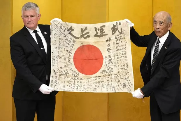 WWII “Good Luck Flag” Belonged to Japanese Solider Returns To Family After 80 Years